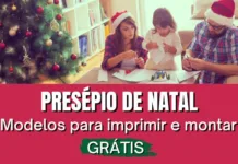 familia recortando papel perto da arvore de natal